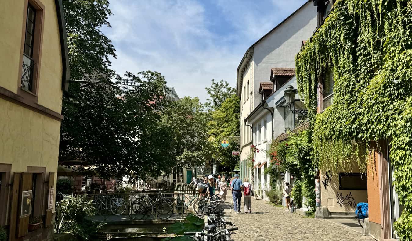 People strolling through the charming streets of Freiburg on a sunny day in Germany